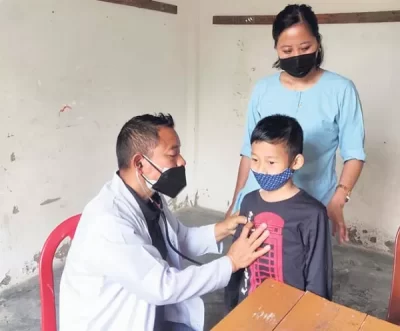 A child being examined at the Reproductive Child Health (RCH) outreach ...