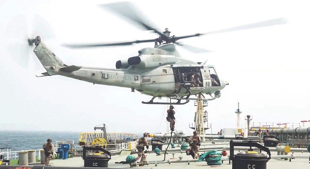 US strikes bridges, key port as its Iran campaign expands