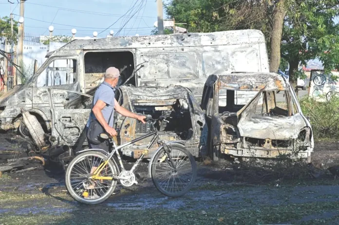 A resident looks at the destruction following a Russian missile attack in Odesa, Ukraine, Friday, July 17, 2026. (AP)_result