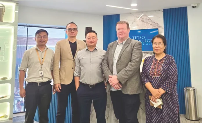 Brian Weir and Theja Meru with others during a visit to Tetso College_result