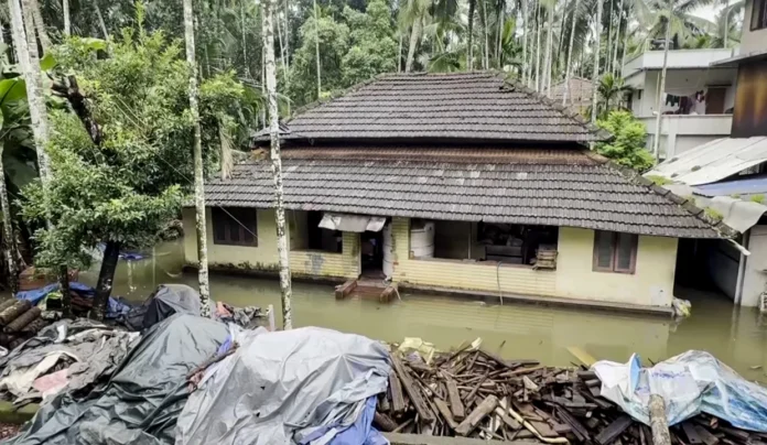 A house in Kerala surrounded by flood water._result