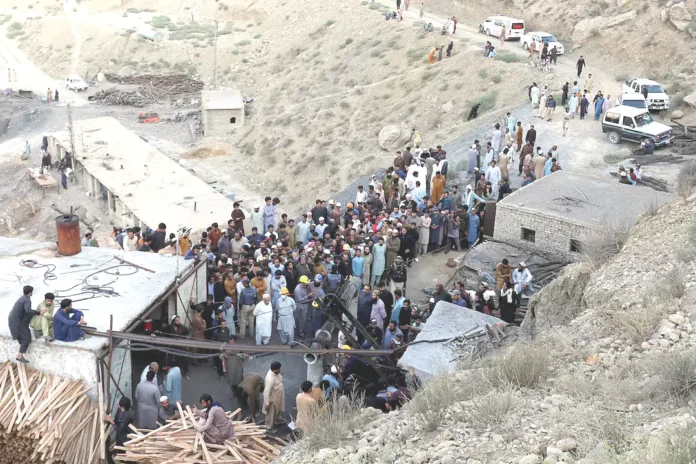 People gather after an explosion buried parts of a coal mining complex on the outskirts of Quetta, Pakistan. ( Reuters)_result
