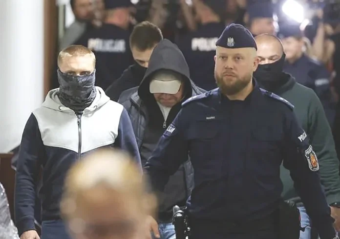 Volodymyr Z. walks escorted by Polish Police at the district court, in Warsaw_result