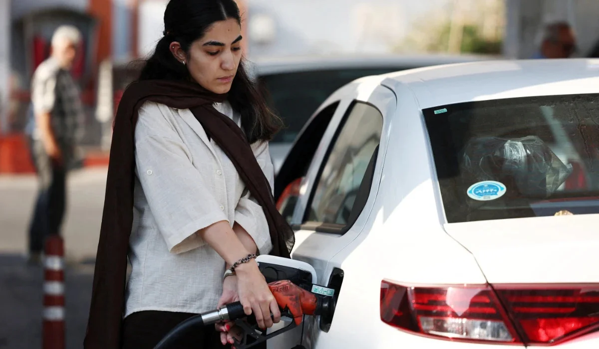 Iran increases gasoline price for its consumers as economy struggles